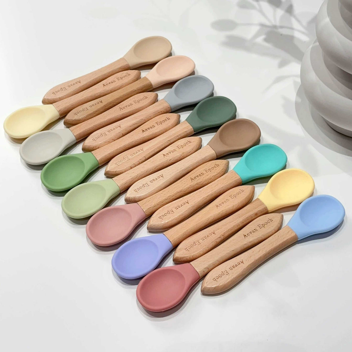 Beechwood Silicone Spoon with natural wood handles and soft silicone heads in assorted pastel colours