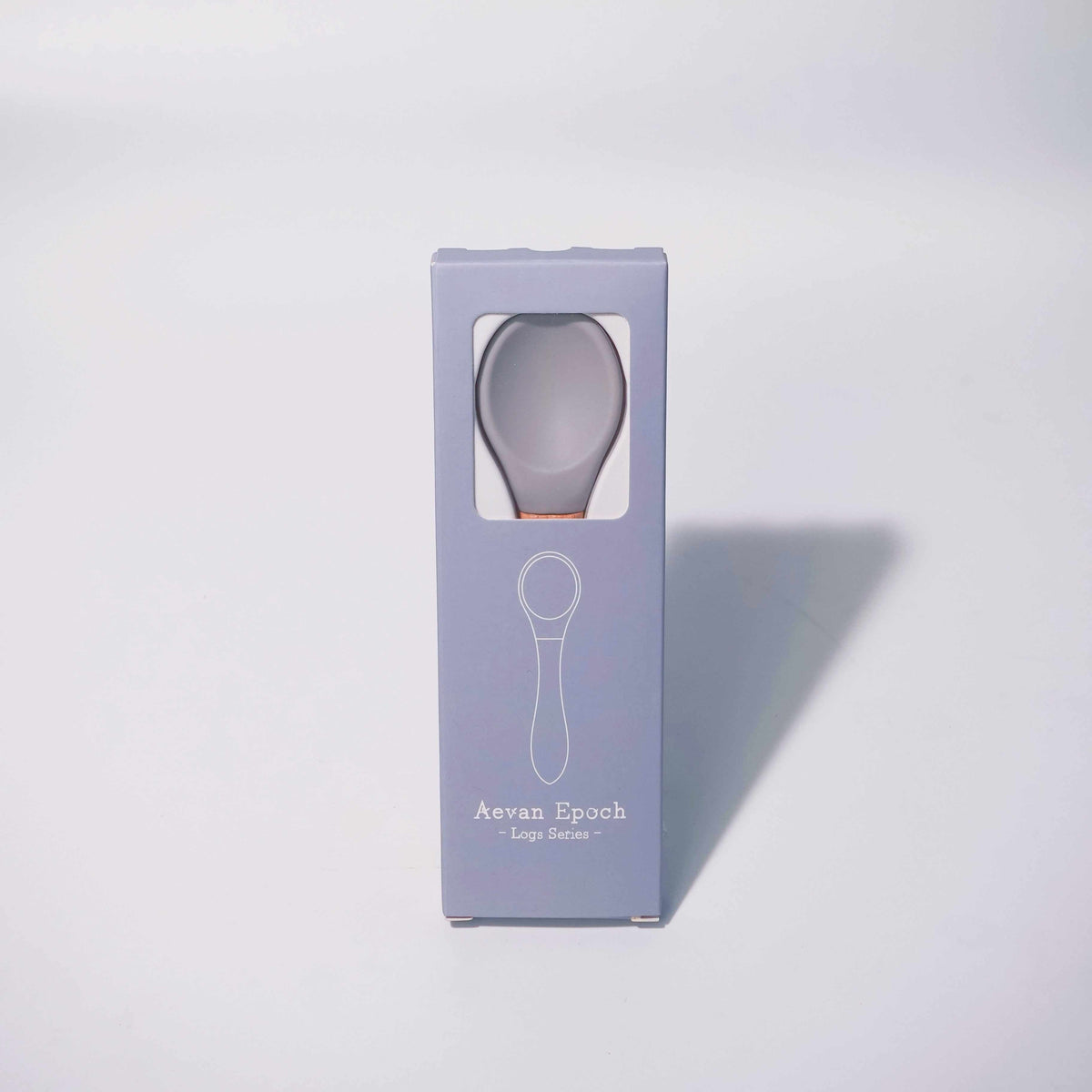 Beechwood Silicone Spoon with a gray silicone bowl and brown wooden handle, packaged in a lavender box