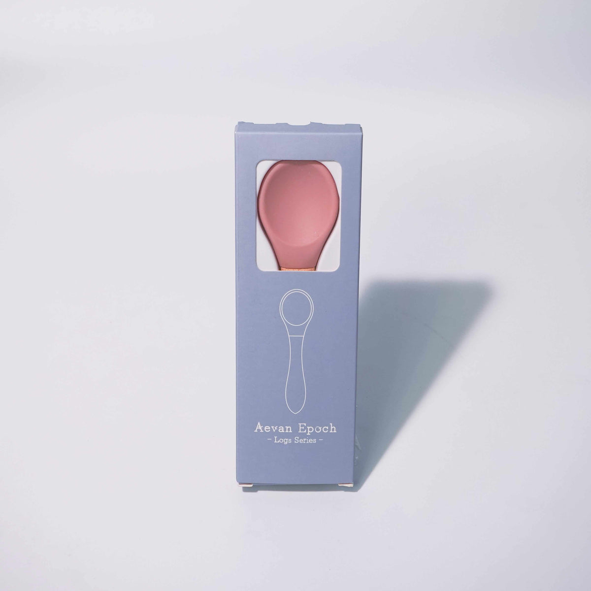 Beechwood Silicone Spoon in a lavender Aevan Epoch box, showing a pink silicone spoon head through a window.