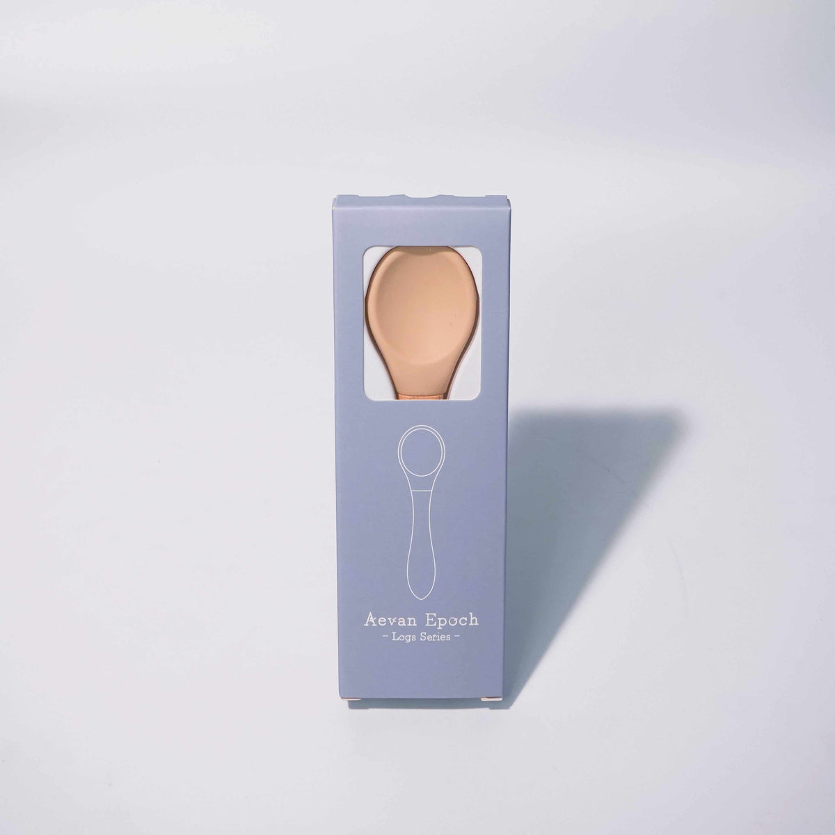 Beechwood Silicone Spoon with a peach silicone head and natural wood handle, displayed in a blue-lavender box