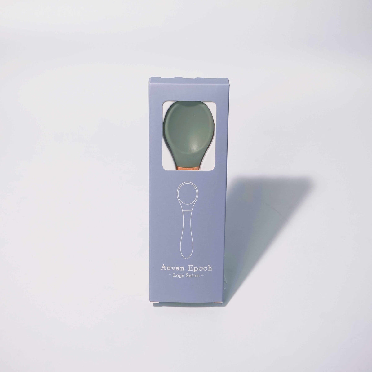 Beechwood Silicone Spoon with a sage green silicone bowl and warm wood-toned handle, shown in a lavender box