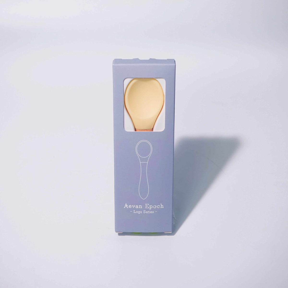 Beechwood Silicone Spoon with a pale yellow silicone bowl and warm-toned wooden handle in a lavender box