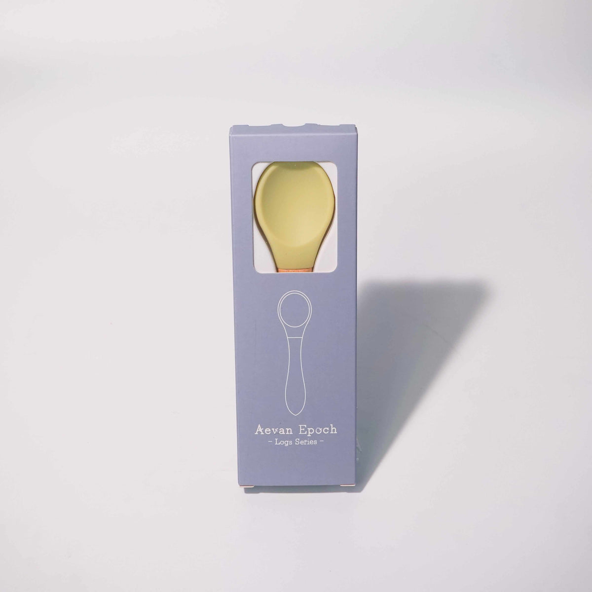 Beechwood Silicone Spoon with a pale yellow silicone bowl and natural wood handle, shown in a lavender box