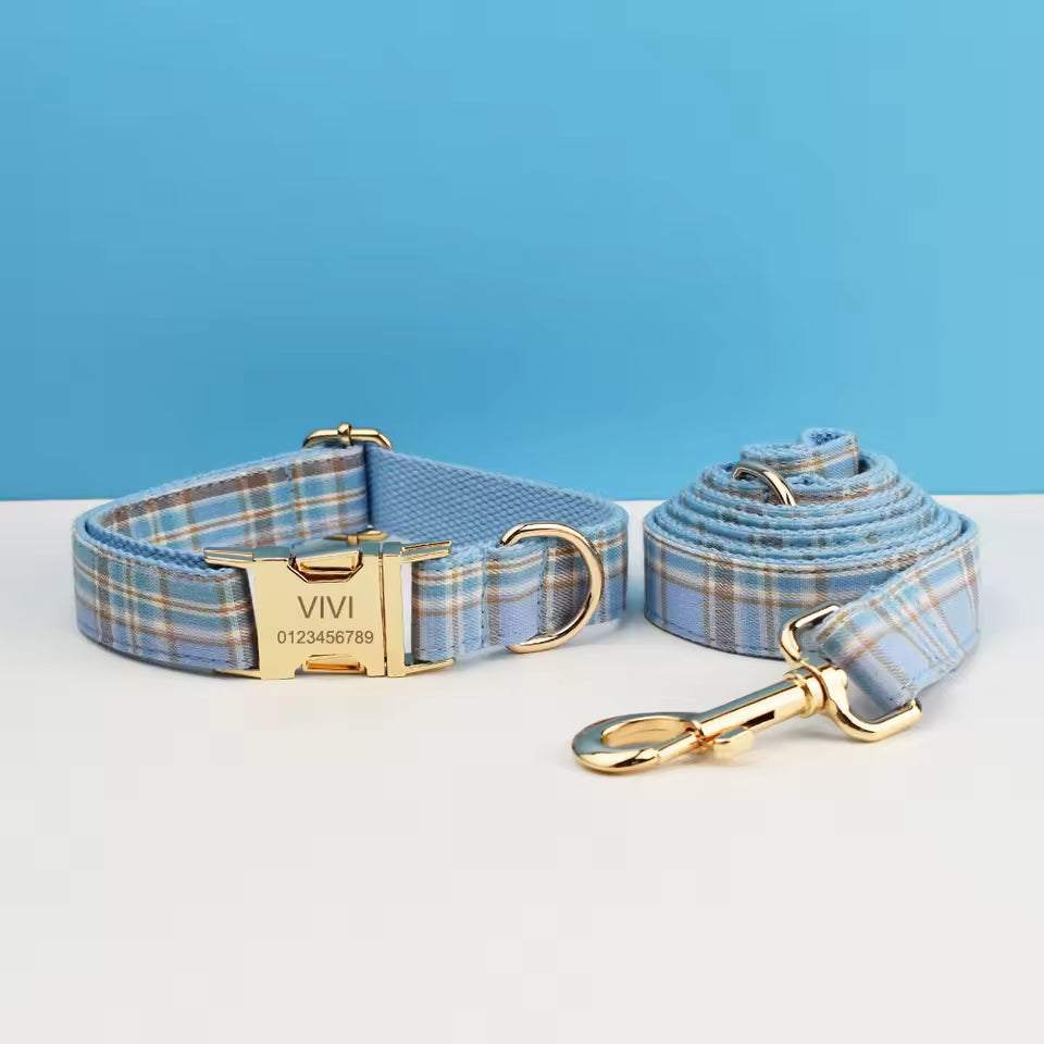personalized no pull dog harness set in light blue plaid nylon, featuring a matching collar and leash with gold-tone hardware