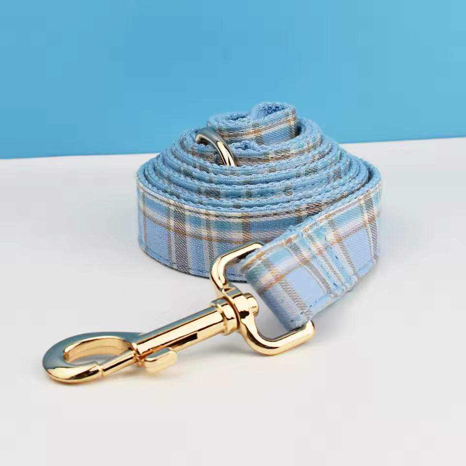 personalized no pull dog harness set includes a light blue plaid nylon leash with gold-tone metal clip and buckle