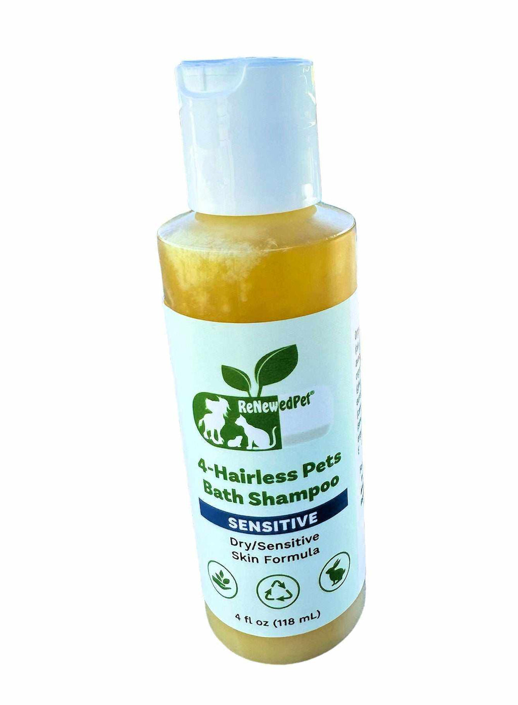 Sensitive Formula Shampoo in a clear bottle with golden liquid, green ReNewedPet label, and blue cap