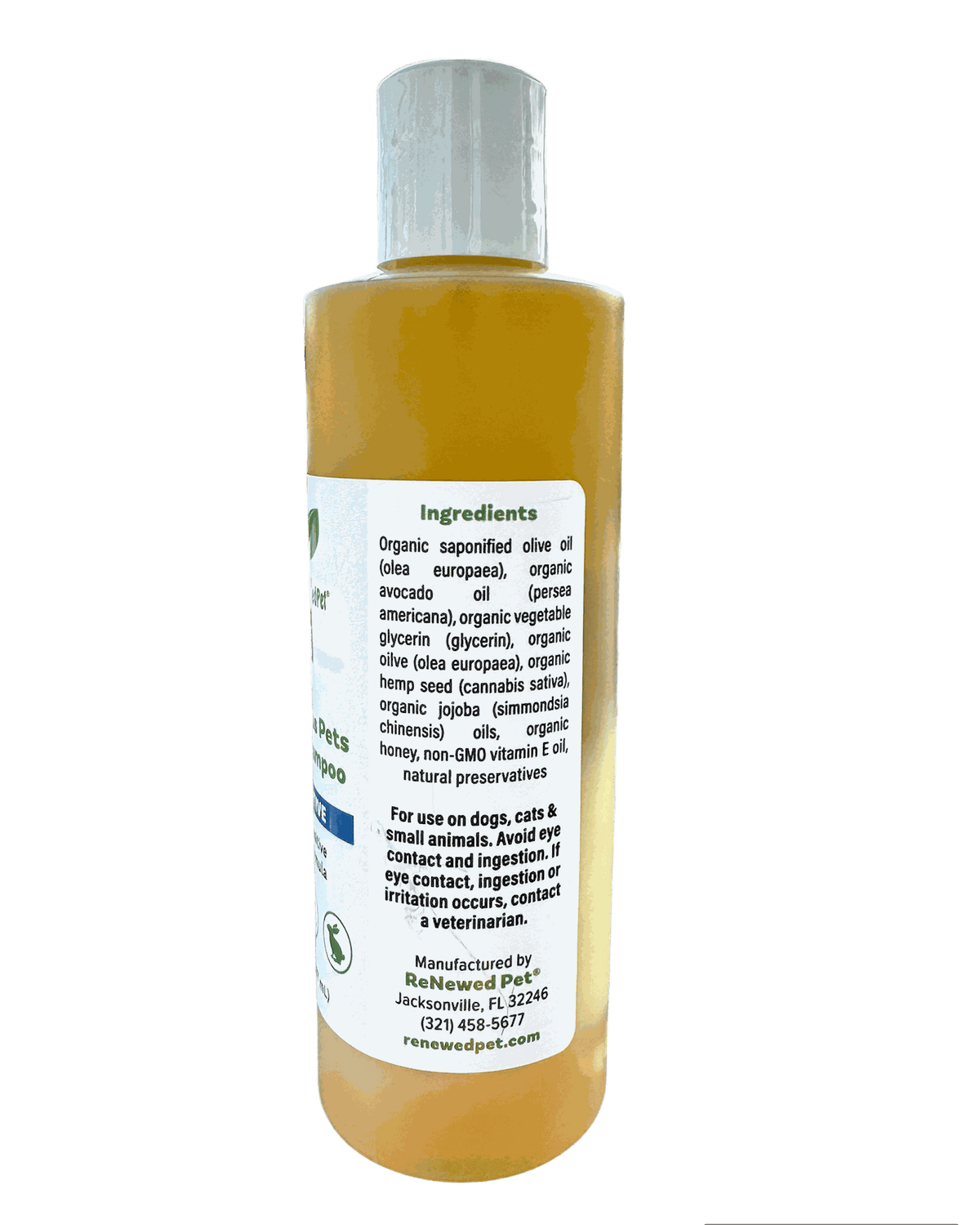 Shampoo bottle with golden yellow liquid, a clear cap, and a white ingredient label; Sensitive Formula Shampoo for pets