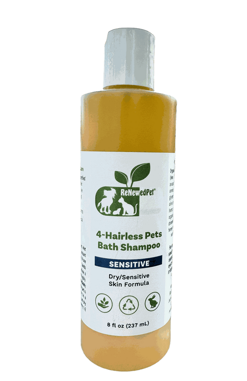 Sensitive Formula Shampoo in a clear bottle with amber liquid and a white label marked for hairless pets